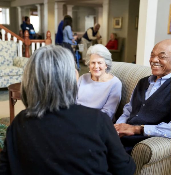 Residents sitting on couches and talking