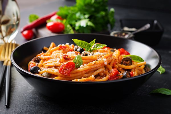 A bowl of pasta on a table