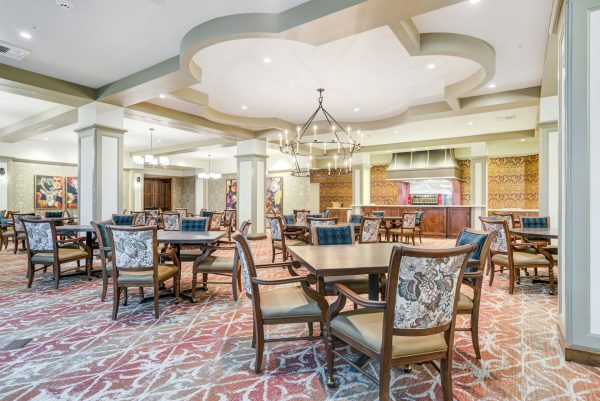 A large seating area with tables and chairs