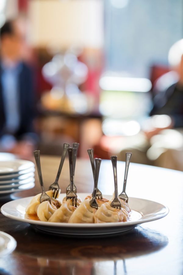 A plate of dumplings on a table.