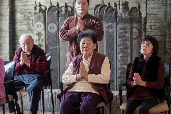 A group of people praying.