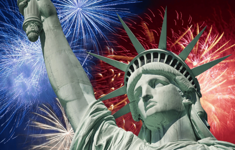Closeup of the Statue of Liberty wit fireworks