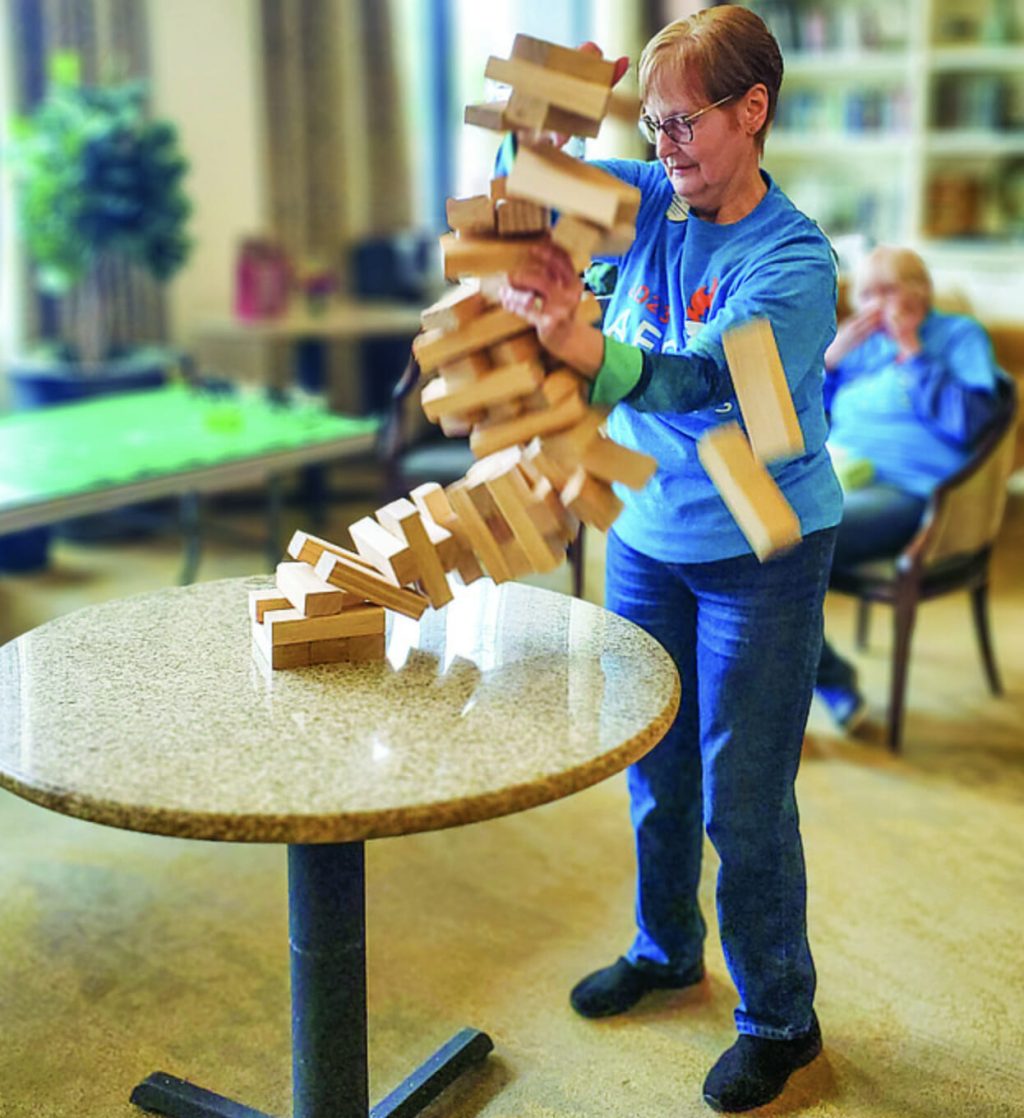 A resident playing Jenga