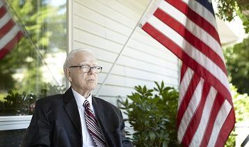 aegis senior resident with USA flag