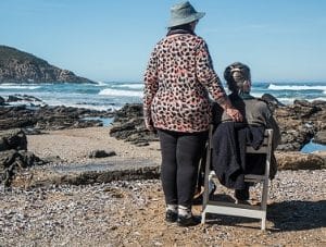 caregiver at beach with loved one