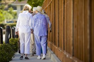 seniors walking to increase their foot health as they age.