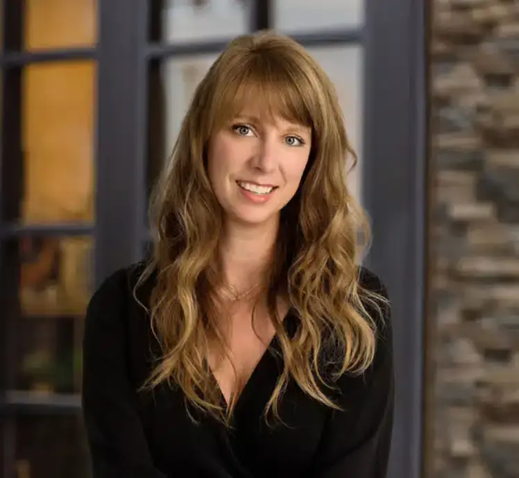 Smiling woman with long hair indoors